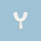 White dental device on a light blue background