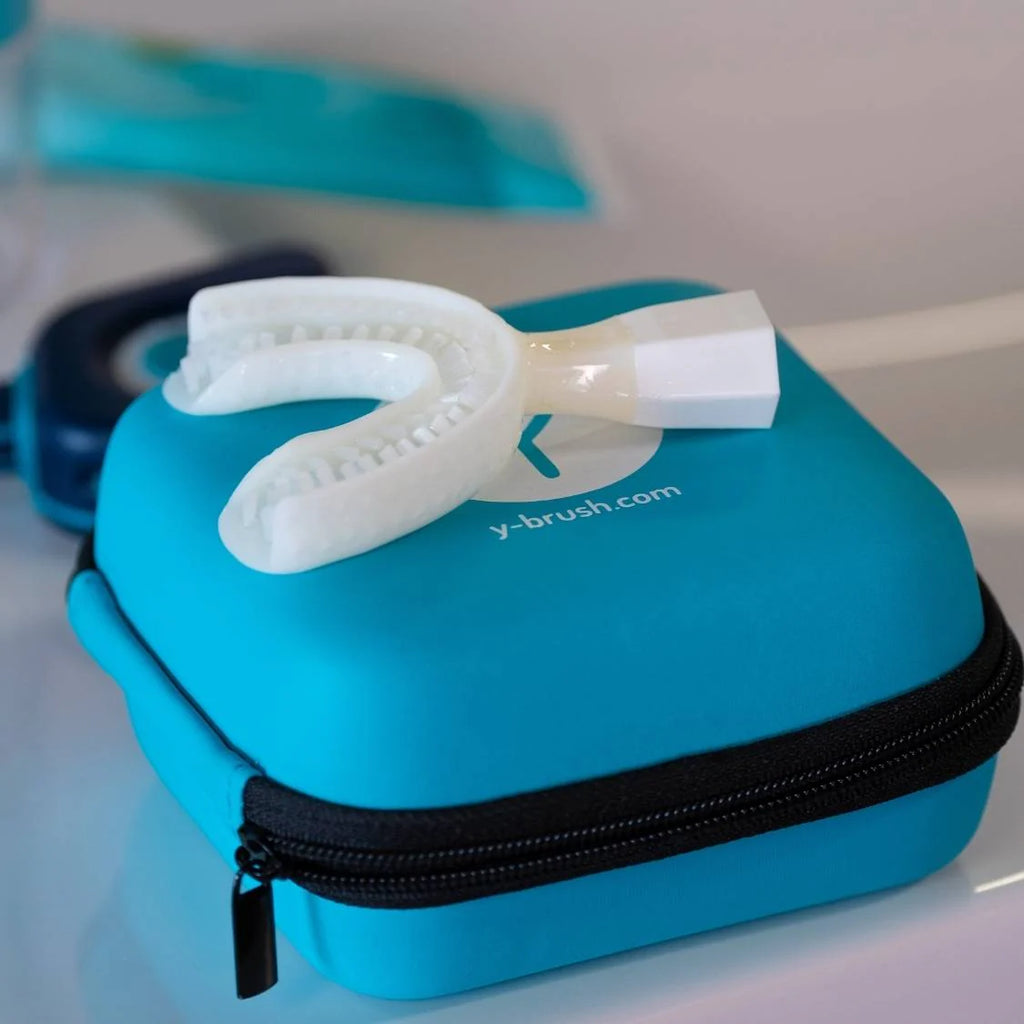 White dental device on a blue box